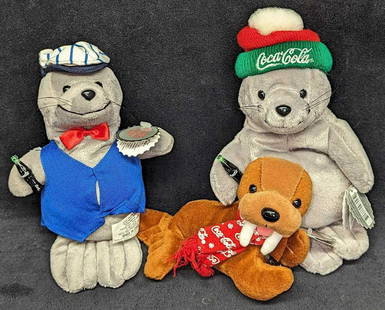 3 Coca-Cola Bean Bag Plush Seals & Walrus: 3 Coca-Cola Bean Bag Plush Seals & Walrus. This lot includes: (1) Coca-Cola Walrus With Coca-Cola Bottle And Logo Scarf. This was released in 1998. This is approx 7" x 3" x 4". (1) Co