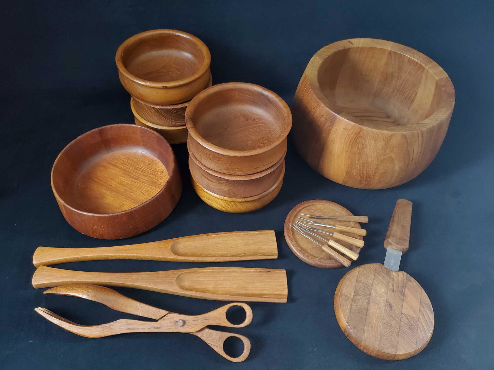 18 Piece Dansk Malaysia Wooden Kitchen Set: This lot of 18 wooden modern pieces consists of: (1) 1 wooden salad tongs and 2 wooden "spoons". These pieces are made from an unknown wood and manufacturer. They are believed to be Dansk as t