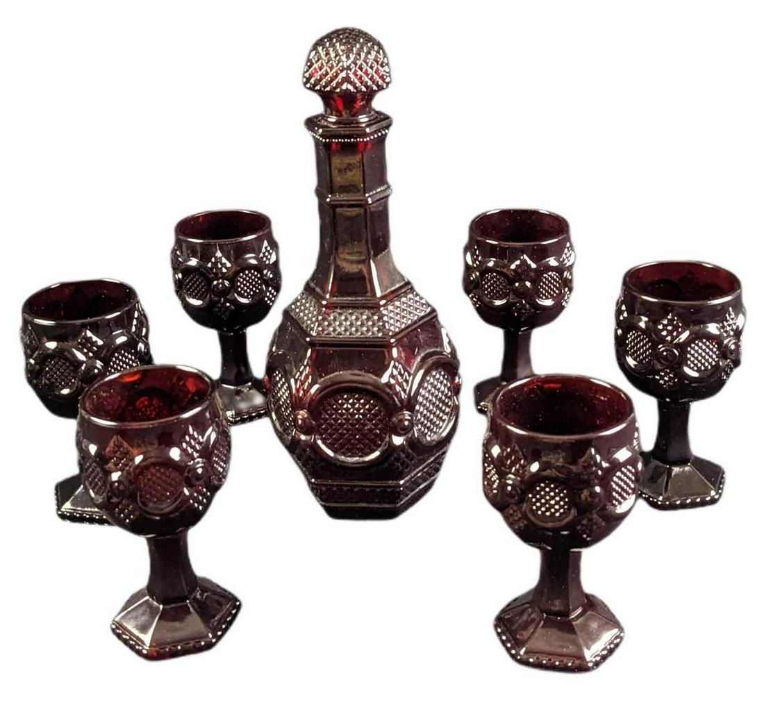 Vintage Avon Cape Cod Ruby Glass Goblets & Decanter: This design was released from 1975 - 1992 by Avon. This lot includes: (6) Wine Goblets. These are approx 2 1/4" x 2 1/4" x 4 1/2". (1) Wine Decanter (Used to contain bubble bath!) Is appr