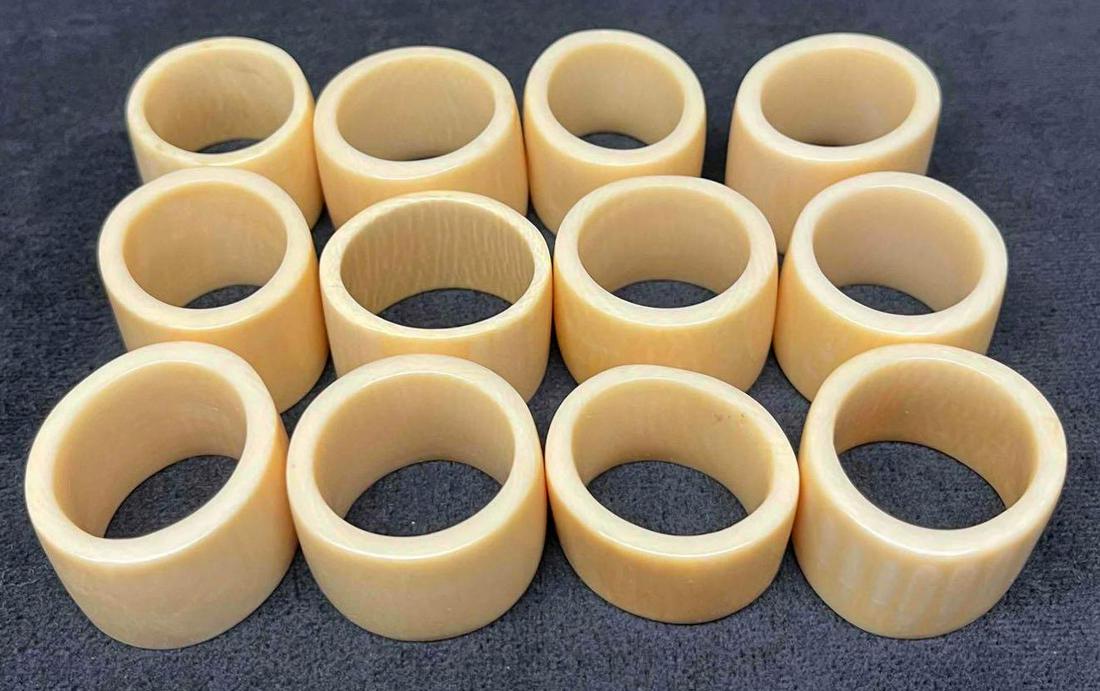 12 Hand Carved Bone Napkin Rings: This lot contains 12 Hand Carved Bone Napkin Rings. Each napkin ring is approx 1 1/4" x 1 1/4" x 1 1/4" and altogether they weigh about 0.4lbs. Overall the Napkin Rings are in good used co