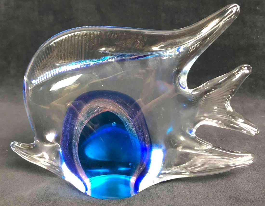 Murano Style Blown Glass Fish: This lot contains a Murano style blown glass fish. This item can be used as a paperweight or for decoration. The glass was hand blown making it thinner and more graceful when compared to machine-made