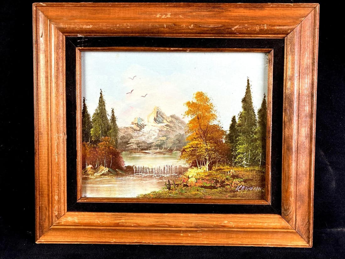 Lake and Mountainside Acrylic Painting: Up for auction is a recent estate find, a acrylic painting of a mountainside and forest view. Location is unknown and the painter signed their name "Keenan" in the lower right. Some of the acr