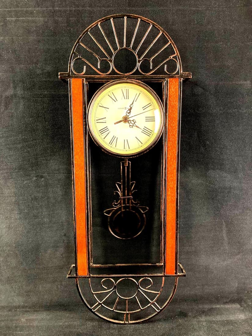 Howard Miller Pendulum Clock: This lot includes: (1) Howard Miller Pendulum Clock Condition is used and see photographs for additional details. The clock requires AA Batteries and there is little evidence of u