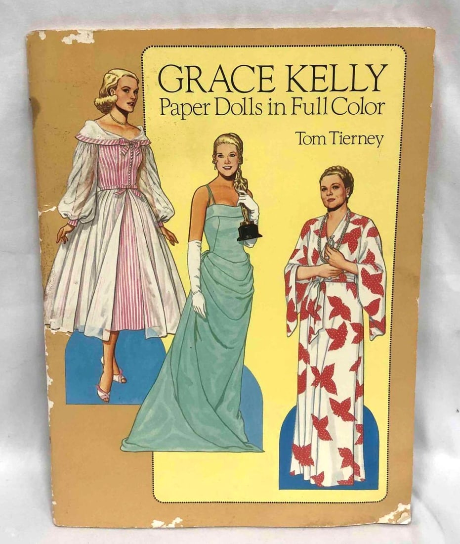 Vintage Complete & Unused Grace Kelly Paper Dolls In Full Color By Tom Tierney 1986: This lot contains a Vintage Complete & Unused Grace Kelly Paper Dolls In Full Color By Tom Tierney 1986. It is approx 12 1/4" x 9 1/4" and they weigh about 0.5lbs. Overall the Vintage Pape
