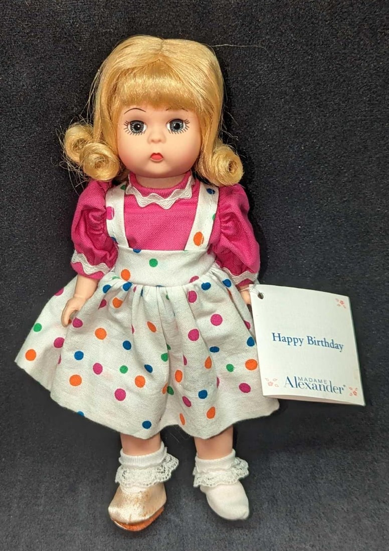 Madame Alexander Happy Birthday Girl Doll: Madame Alexander Happy Birthday Girl Doll. The plastic doll comes in its original box which is approx 5 1/4" x 8" x 2 3/4' and it weighs 0.47lb. The doll is approx 3" x 2" x 7 3/4&