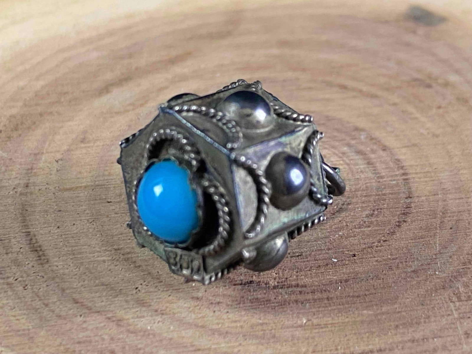 Antique Balinese Prayer Wheel 800 Silver Charm / Pendant: Antique Balinese Prayer Wheel 800 Silver Charm / Pendant Balinese Prayer Wheel 800 Silver Marked ( Tested) Natural Turquoise Cab 2.8 g 14MM x 19mm Very Good Antique Condition