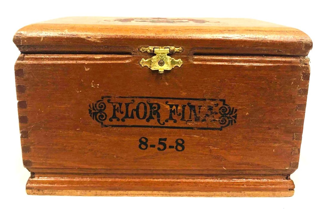 Flor Fina 8-5-8 Wood Cigar Box: This lot contains Flor Fina 8-5-8 Wood Cigar Box. It is approx 6 3/4" x 4 1/4" x 4 1/4" and it weighs about 0.5lbs. Overall the Wood Cigar Box is in good used condition with some light wea