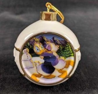 Disney Porcelain Donald Duck Christmas Ornament: Disney 'Artist Collection' Christmas Porcelain Ornament of Donald Duck and Daisy Duck. The retired ornament is in good, used condition with no visible scratches or dings. Is approx 3" x 3&