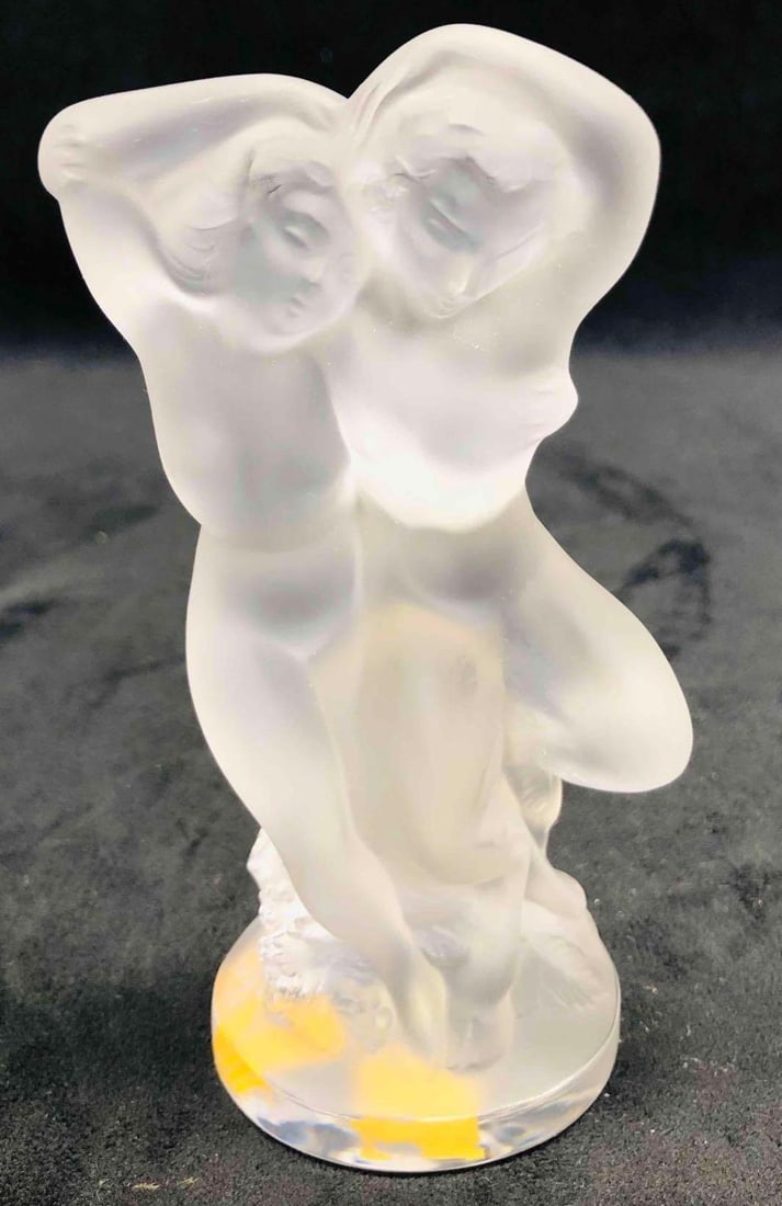 Lalique Nude Man & Woman Figurine: This lot contains a Lalique Nude Man & Woman Figurine. It is approx 2" x 2 1/4" x 5 1/2" and it weighs about 0.8lbs. Overall the Lalique figurine is in good used condition with some li