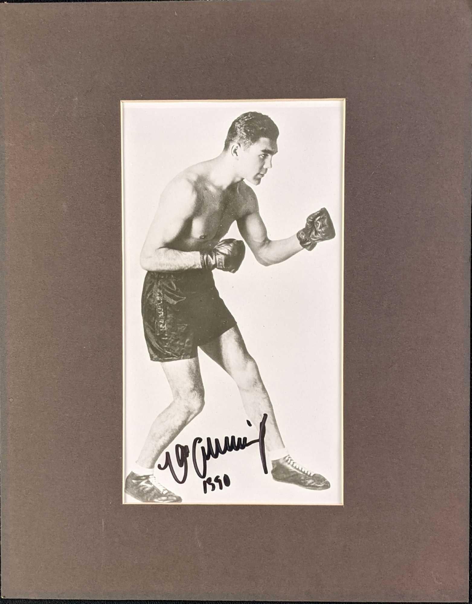 Autographed Boxing Legend Max Schmeling Photo: Autographed Boxing Legend Max Schmeling Photo. The matted photo is approx 11" x 14" and it weighs under one pound at 0.13lb. The photo itself is approx 8" x 10". The photo is in a good
