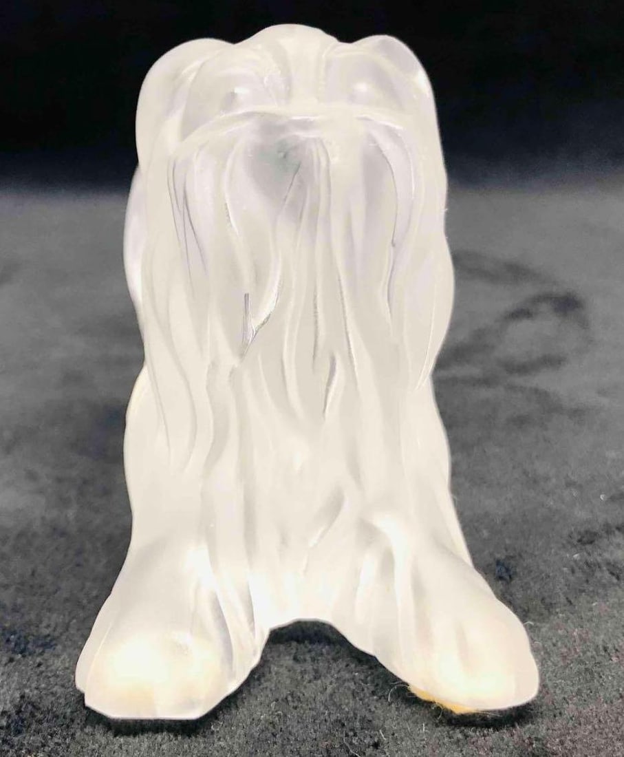 Lalique Signed Yorkshire Terrier Dog: This lot contains a Lalique Yorkshire Terrier Dog. It is approx 3 3/4" x 1 3/4" x 2 3/4" and it weighs about 0.8lbs. Overall the Lalique Terrier is in good used condition with some light w