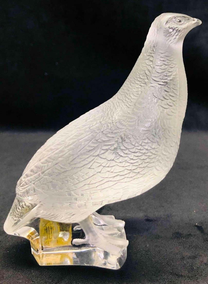 Signed Lalique Crystal Patridge: This lot contains a Signed Lalique Crystal Patridge. It is approx 5" x 2" x 6 3/4" and it weighs about 3lbs. Overall the Lalique Patridge is in good used condition with some light wear fro