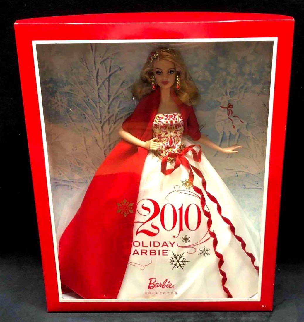2010 Holiday Barbie: This lot contains a 2010 holiday Barbie from the Barbie Collector. This Barbie comes in her original packaging and has never been opened. Accessories include her earrings, shoes and dress. The box is