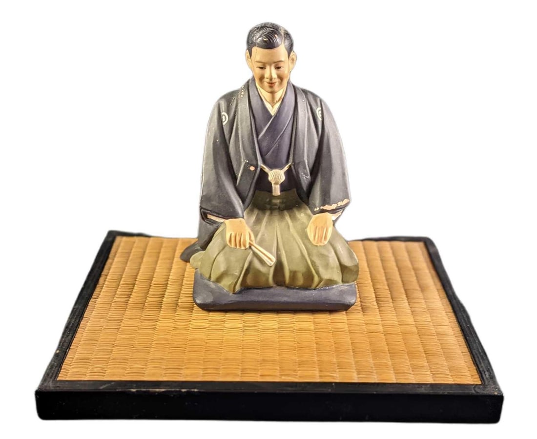 Vintage Hakata Urasaki Doll Young Man With Fan: Vintage Hakata Urasaki Doll Young Man With Fan. Made of ceramic. Hakata dolls are the best-known craft items from Fukuoka Prefecture, which lies in the north of the island of Kyushu. The origin of thi
