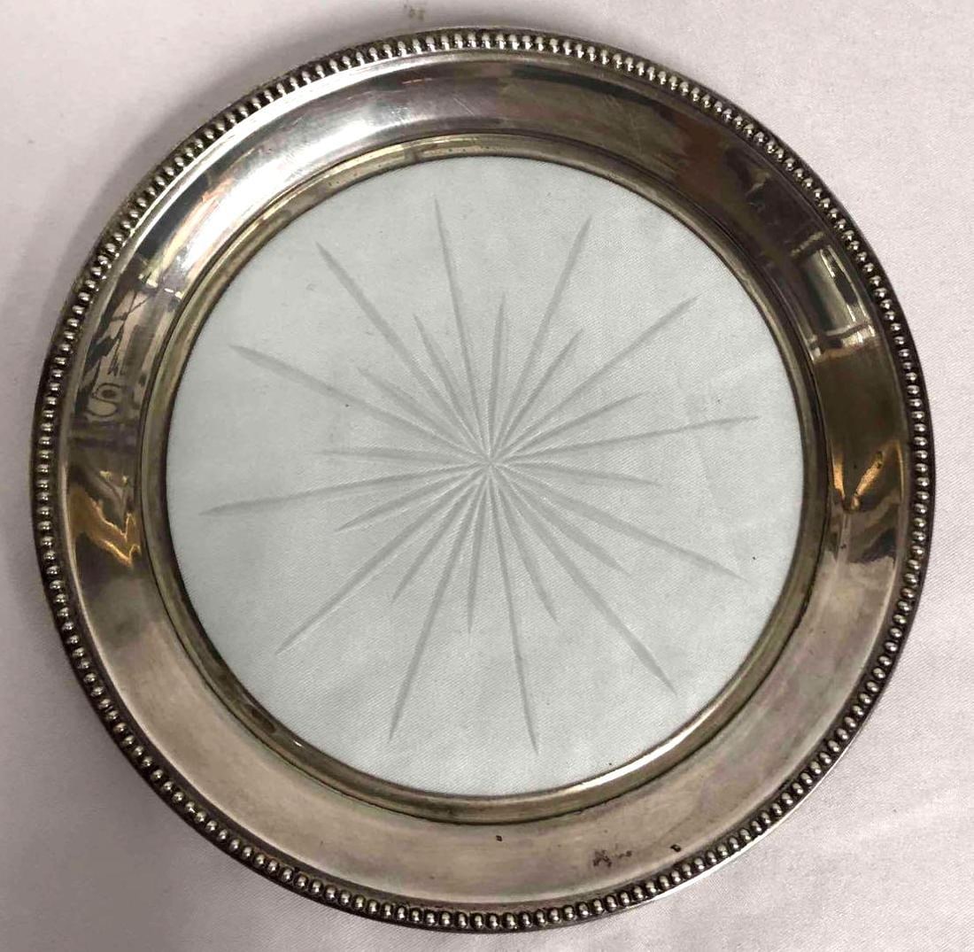 Frank M Whiting & Co. Sterling Coaster/Trinket Dish + Swarovski Crystal Building Trinket: This lot contains a bundle of a Frank M Whiting & Co. Sterling wine coaster or trinket dish with a sterling silver rim and a miniature Swarovski crystal figurine building. The coaster/trinket dish