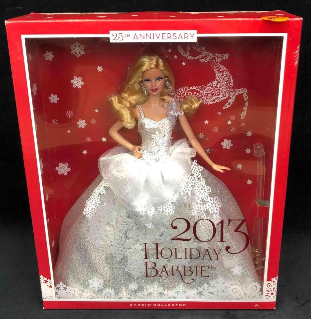 2013 Holiday Barbie: This lot contains a 2013 holiday Barbie from the Barbie Collector. This Barbie comes in her original packaging and has never been opened. Accessories include her earrings, shoes, dress and stand. The 