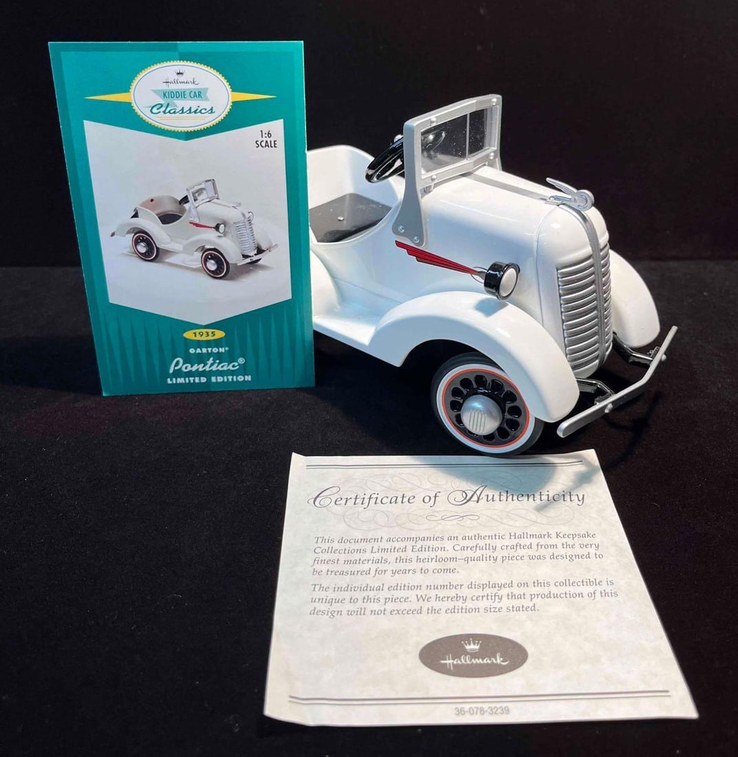 Limited Edition 2001 Kiddie Car Classic "1935 Garton Pontiac" With COA & Hallmark Card: This lot contains a Limited Edition 2001 Kiddie Car Classic "1935 Garton Pontiac" With COA & Hallmark Card. This car ia marked 06145 of 14,500. It is approx 7 1/4" x 3 3/4" x 4"