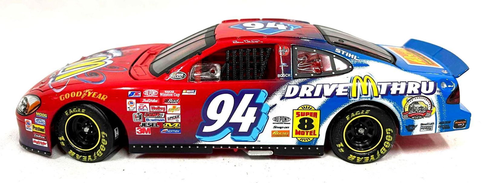 Bill Elliot #94 McDonald's/McFlurry 2000 Ford Die Cast Car: This lot contains a Bill Elliot #94 McDonald's/McFlurry 2000 Ford Die Cast Car. It is approx 8 1/2" x 3 1/4" x 2 1/2" and it weighs about 1.3lbs. Overall the Die cast car is in good us