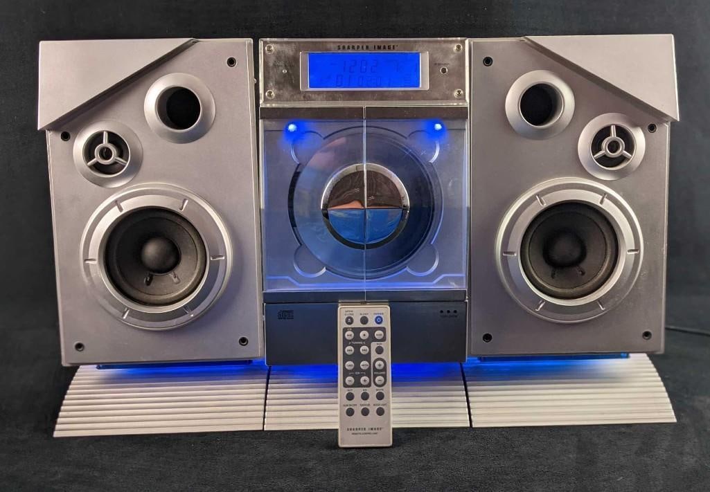 Sharper Image Sleek CD Stereo Radio Alarm Box: Sharper Image Sleek CD Stereo Radio Alarm Box. "Sleek CD" by Sharper Image. Fun little CD/Radio/Alarm all in one! Comes with everything you see in the images. Everything was tested and it all