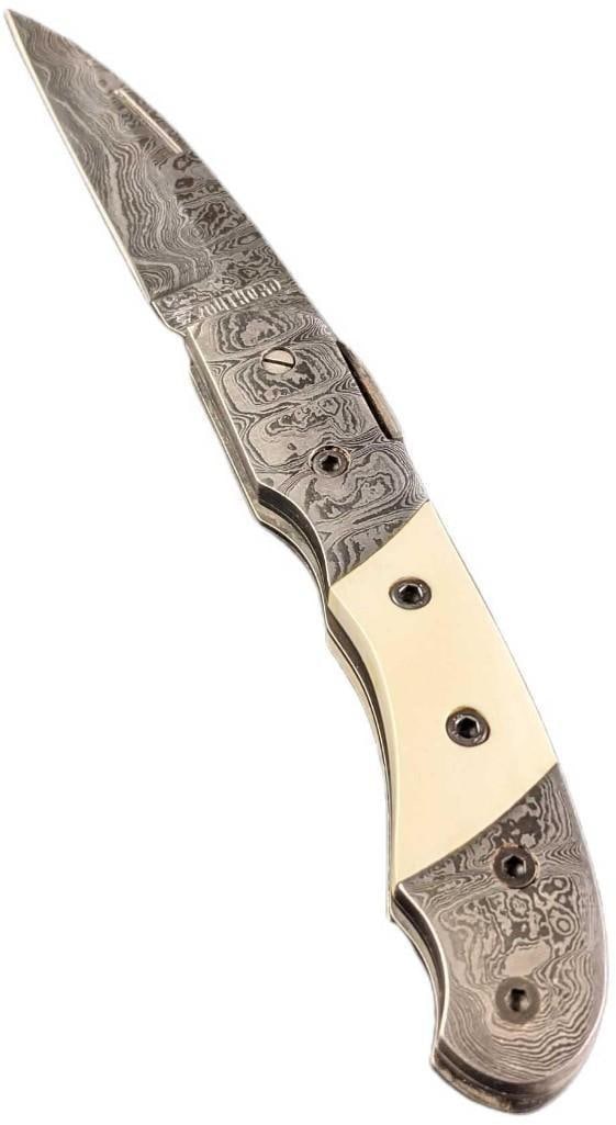 Damascus Steel Fold Up Stag Horn Handle Knife Retired: Damascus Steel Fold Up Stag Horn Handle Knife Retired. Here is a fold-up knife made of imported Damascus steel with a stag horn handle. These were made in very limited batches by a small company in Or