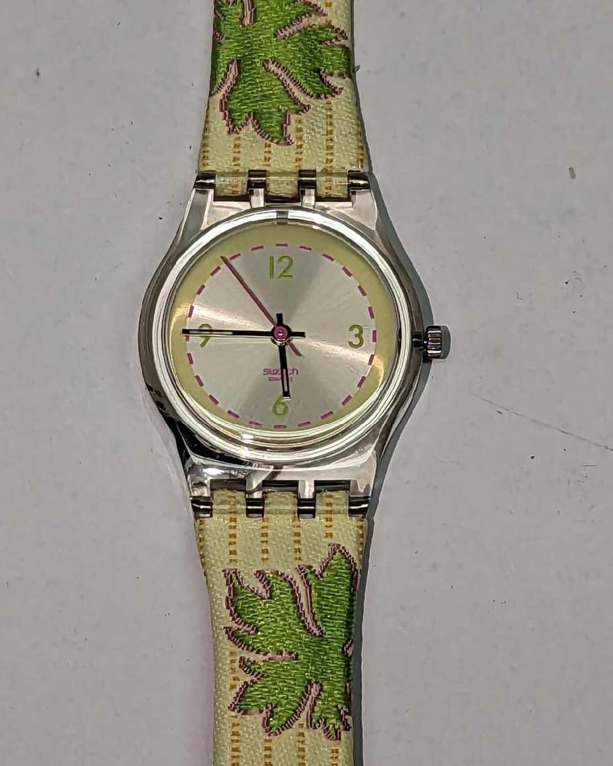 Swatch Watch "Don't Leaf Me" Lady's Watch: Swatch Watch "Don't Leaf Me" Lady's Watch. Comes in its original box which is approx 1 3/4" x 3/4" x 10" and it weighs 0.17lb. The watch is in a good, unused condition with