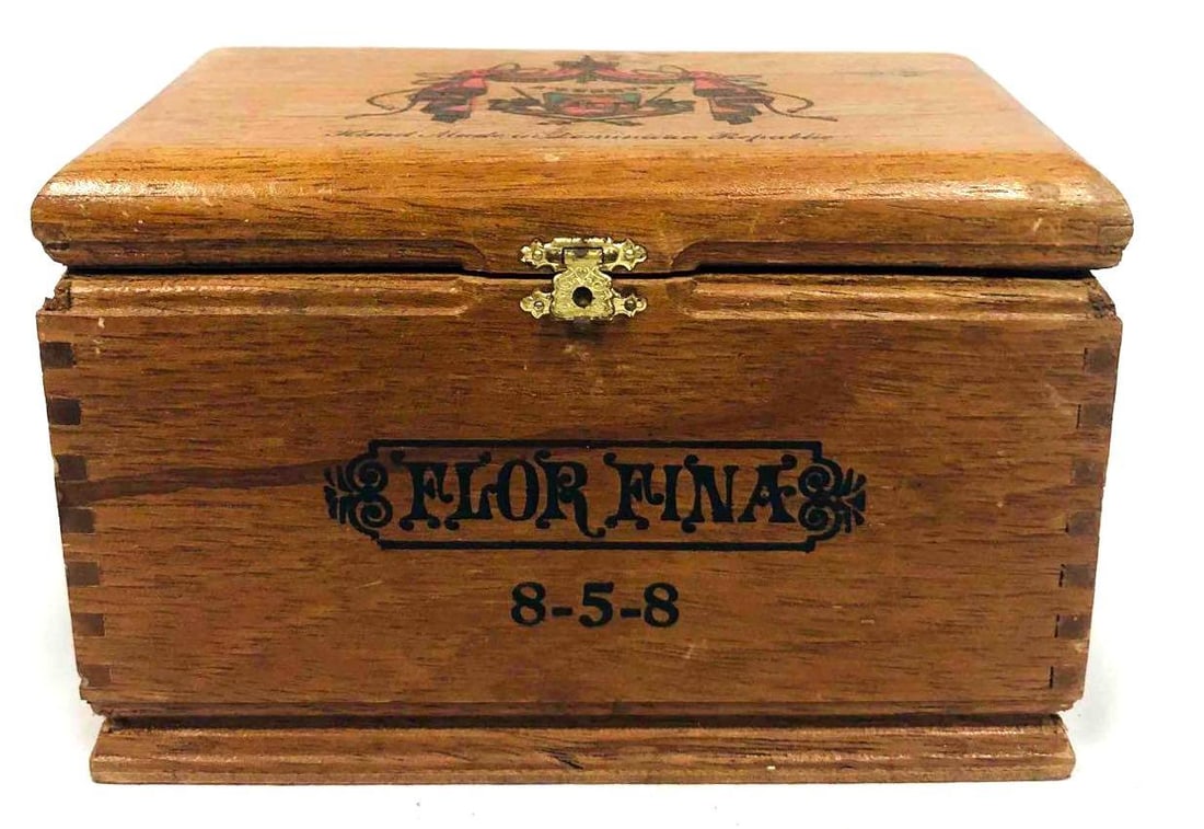 Flor Fina 8-5-8 Wood Cigar Box: This lot contains Flor Fina 8-5-8 Wood Cigar Box. It is approx 6 3/4" x 4 1/4" x 4 1/2" and it weighs about 0.5lbs. Overall the Wood Cigar Box is in good used condition with some light wea
