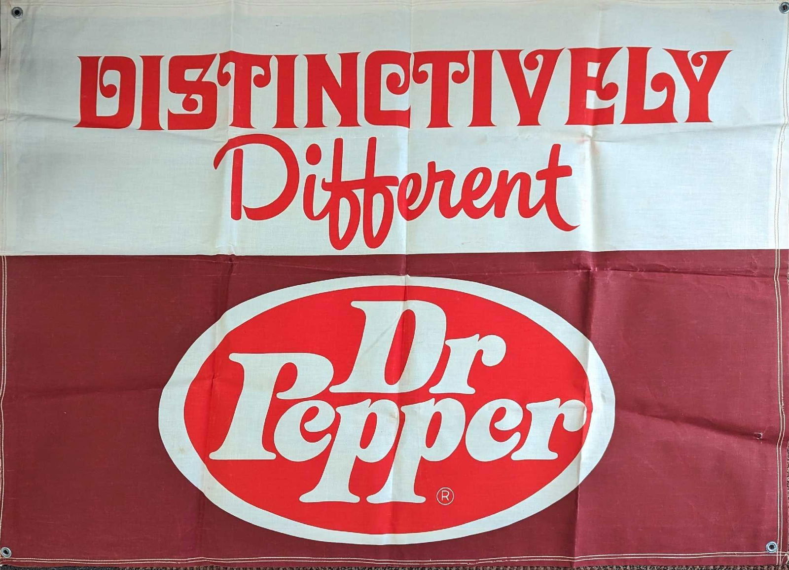 Vintage Distinctively Dr Pepper Banner: Vintage Distinctively Dr Pepper Banner. This is approx 47" x 34" and it weighs 0.63lb. The folded banner is approx 14 3/8" x 1/2" x10 1/2". The banner has some markings on the bag