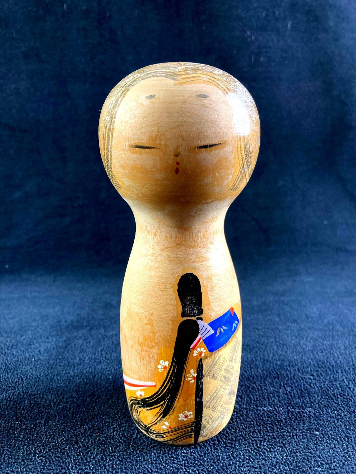 Asian Wooden Figurine/Doll: This lot includes: (1) Asian Wooden Figurine/Doll Condition is used and see photographs for details. The wooden doll is painted on the front to resemble a woman. The bottom has a k