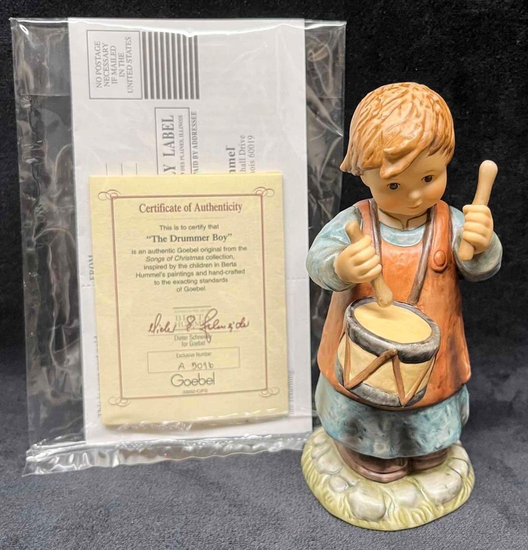 "The Drummer Boy" Hummel In Box With COA: This lot contains a "The Drummer Boy" Hummel In Box With COA. The box is approx 7 3/4" x 7 1/2" x 5 1/4" while the Hummel is approx 2 1/4" x 2 1/4" x 5 3/4". Total weig