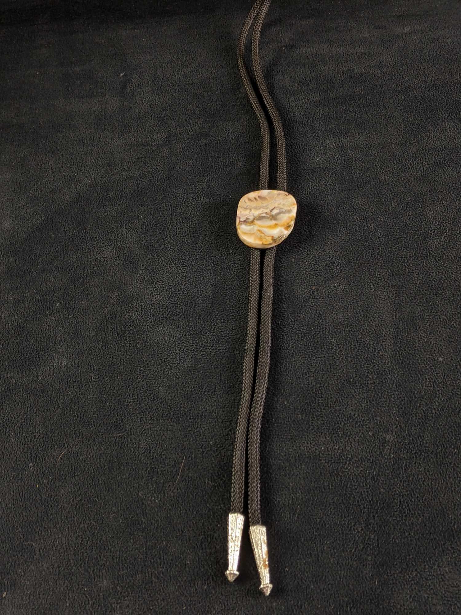 Bolo Tie With Natural Tumble Polished Jasper: Bolo Tie With Natural Tumble Polished Jasper This bolo tie is with beautiful natural Jasper and silver ends. This tie is in great condition.