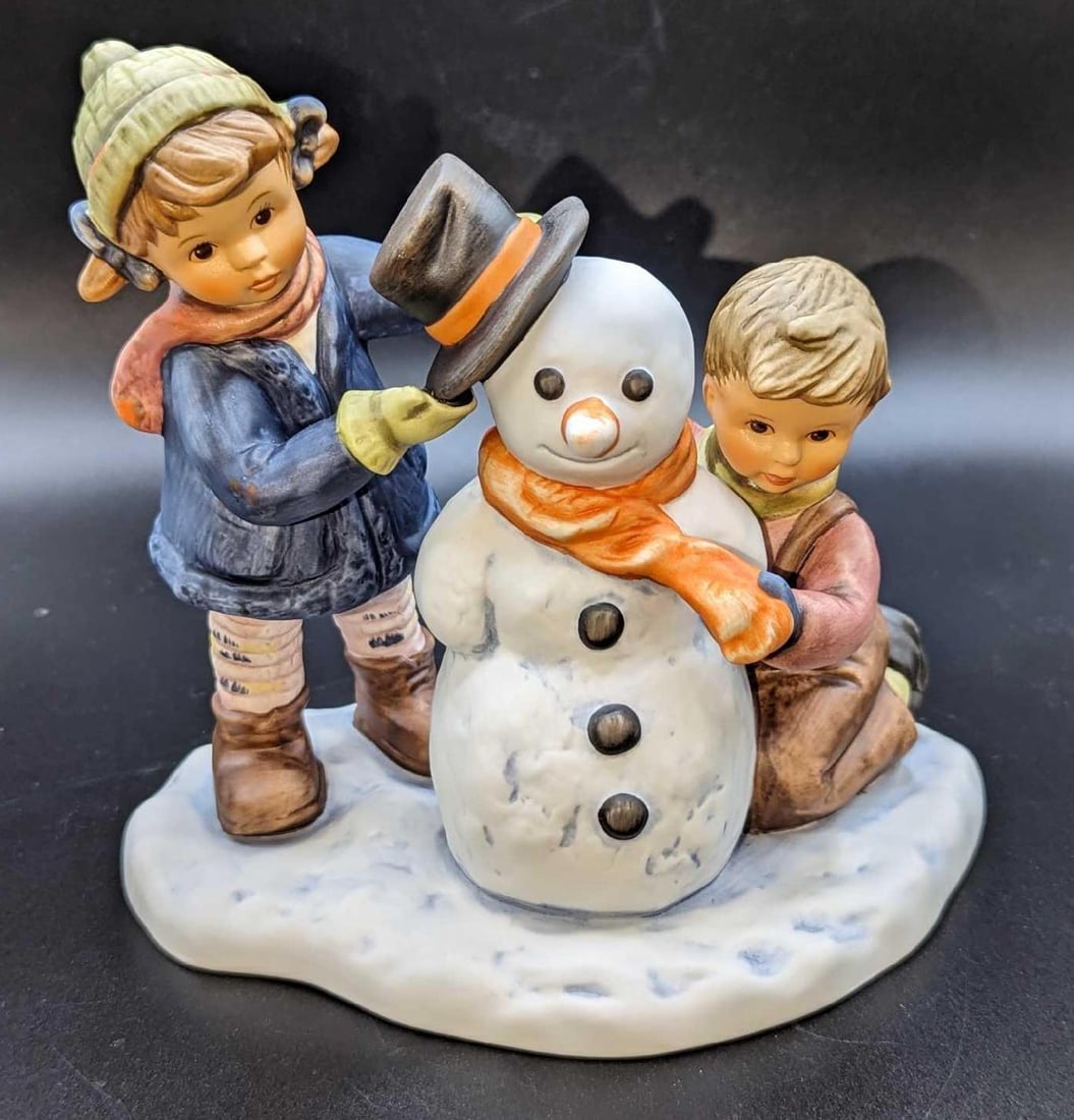 Goebel Berta Hummel 1999 Crowning Touch Figurine: Goebel Berta Hummel 1999 Crowning Touch Figurine. This is approx 6" x 4" x 5 1/2".This comes in its original box that is approx 11 3/4" x 7 1/2" x 6 1/4" and it weighs 2.14 lbs