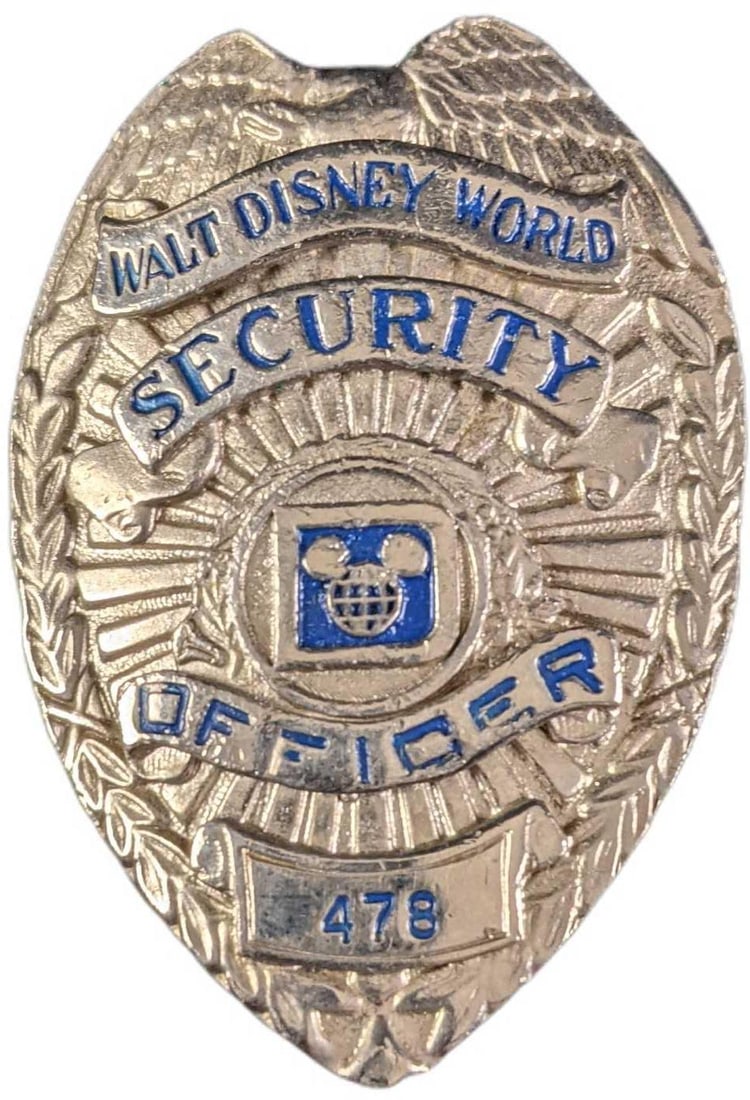 1970s/1980s Disney World Security Metal Badge: 1970's/1980's Disney World Security Metal Badge. Is approx 2 1/4" x 3/4" x 3" and it weighs under one pound at 0.14lb. The metal badge is in a good, vintage condition with some wea