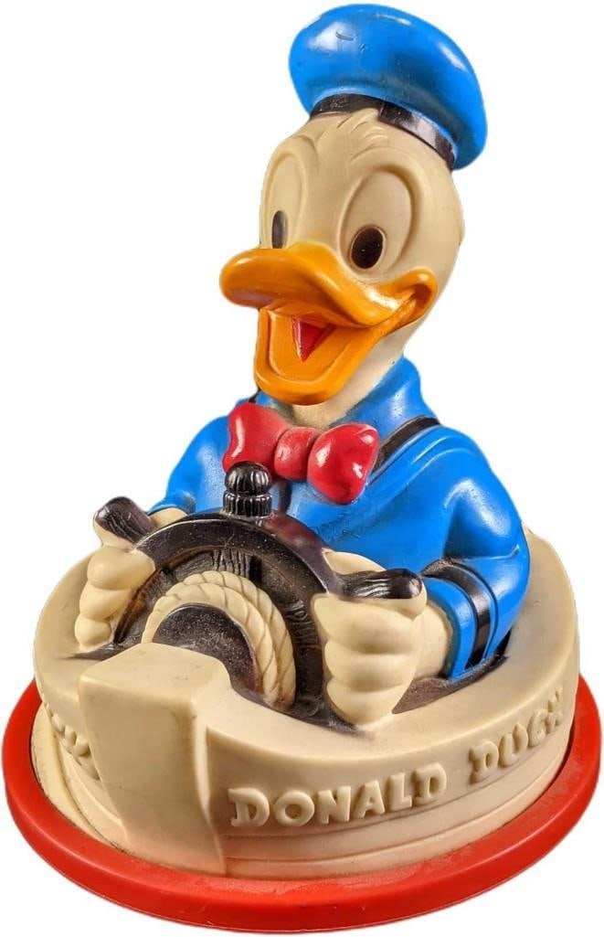 Vintage Disney Donald Duck Roly Poly Boat Toy: Hard plastic "Roly Poly" boat toy that makes chime sounds as it rocks back and forth. The toy is approx 7" x 6" x 8" and it weighs under one pound at 0.91lb. The boat toy is in goo