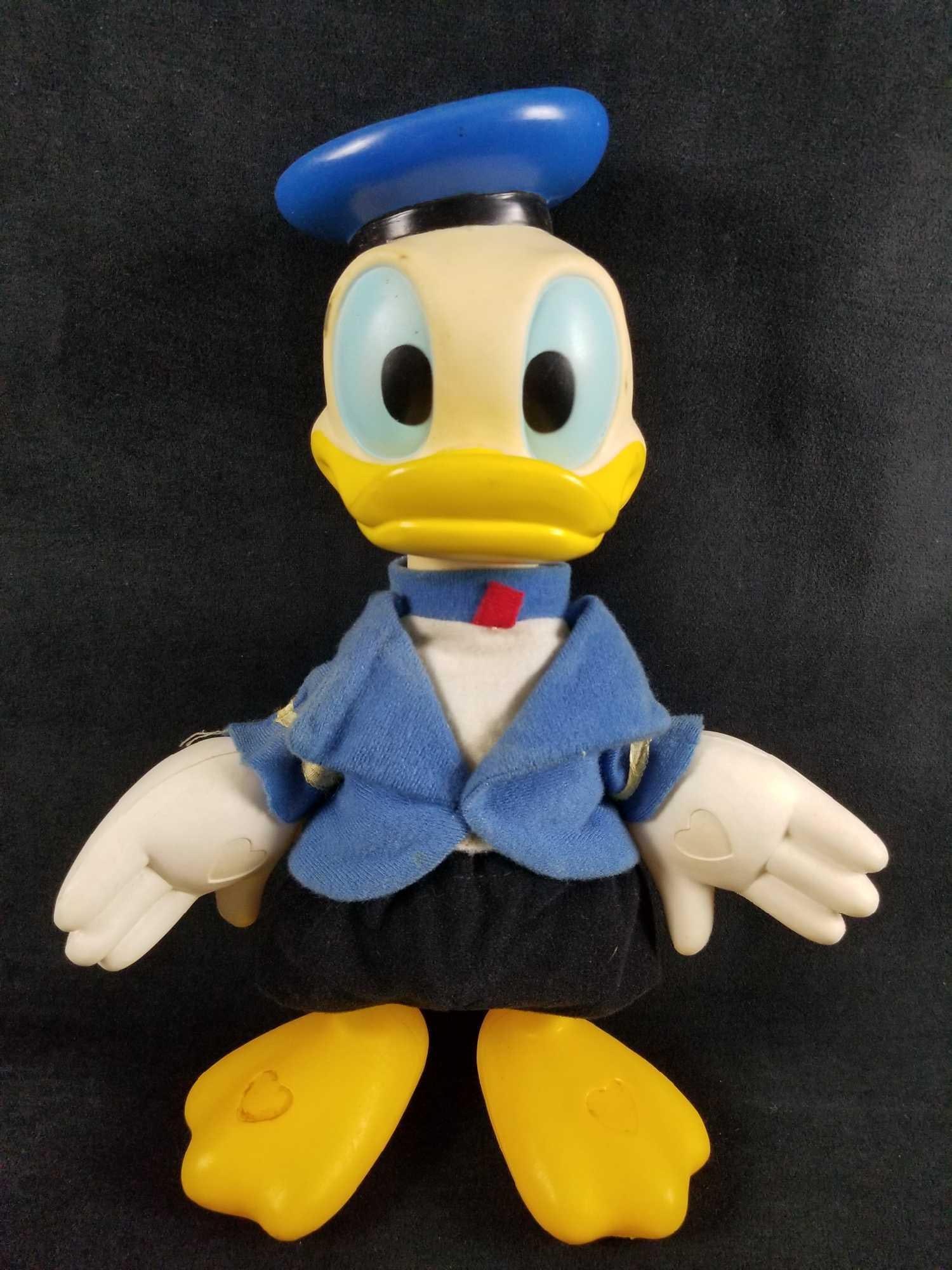 Vintage Classic Donald Duck Plastic Walt Disney Productions MTC Hong Kong: Donald Duck all dressed up in his classic Donald Duck sailor outfit. His stuffed foam body is completed with his plastic arms, feet and head. The palms and feet have engrave hearts. Appears to be from