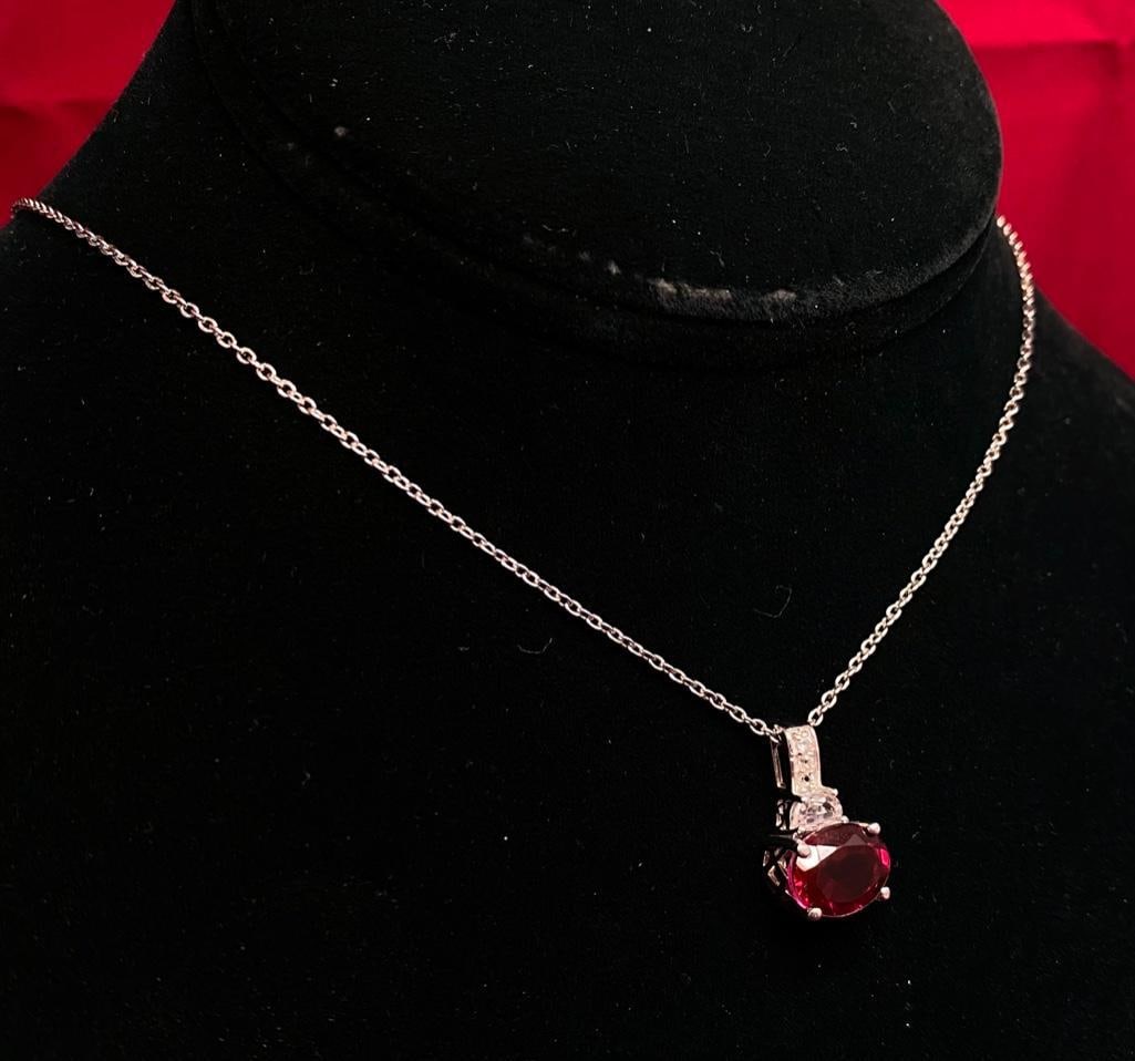 Sterling Silver Ruby Simulant Pendant: This piece of jewelry as been tested and researched prior to testing . Please view all our pictures they are part of our description. DETAILS: Metal - Sterling 925 Color - Silver Stones - Simulated ru