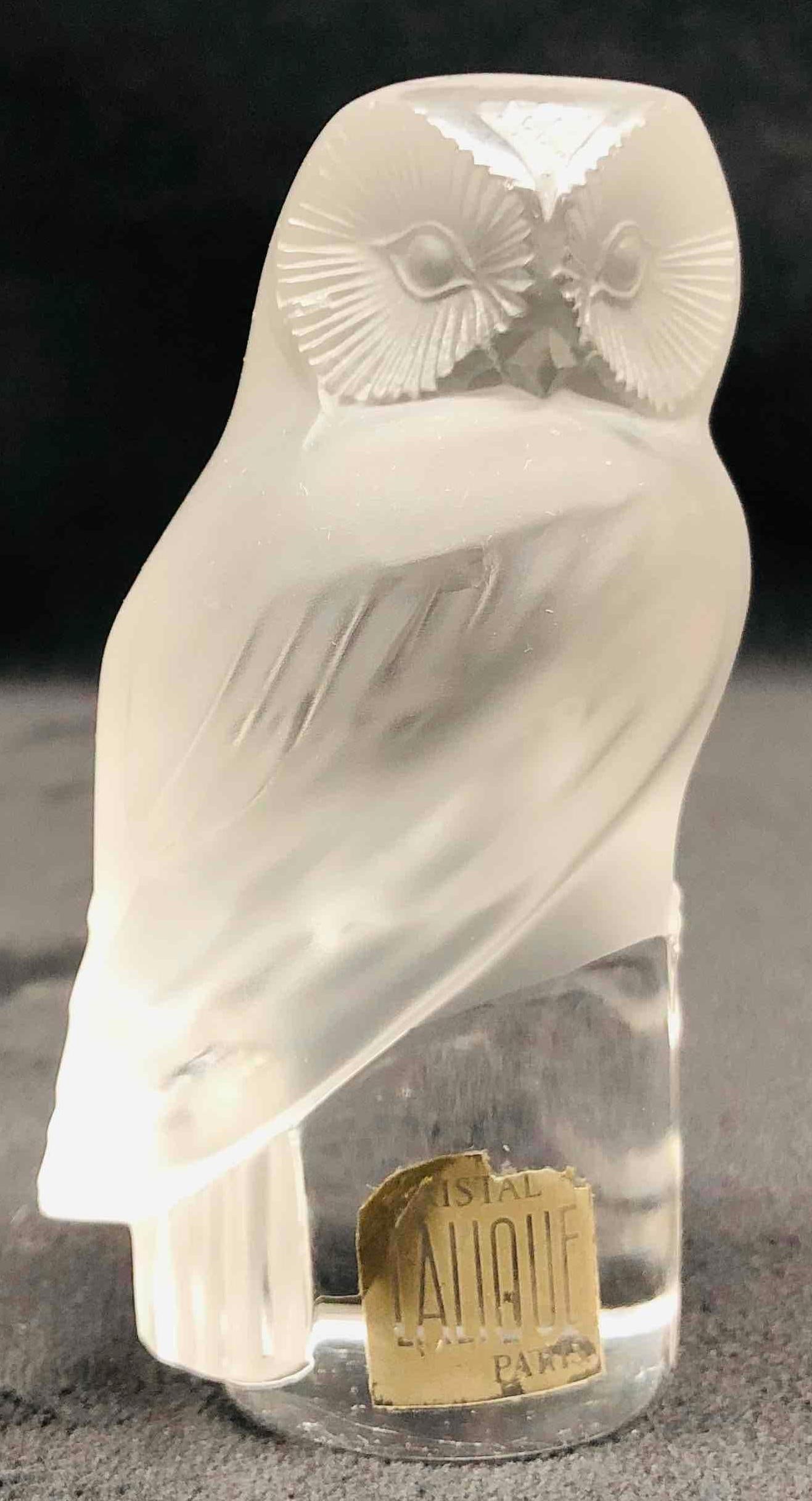 Crystal Lalique Signed Owl Paris: This lot contains a Lalique Signed Crystal Owl Paris France. It is approx 2" x 1 1/4" x 3 1/4" and it weighs about 0.5bs. Overall the Lalique Owl is in good used condition with some light 