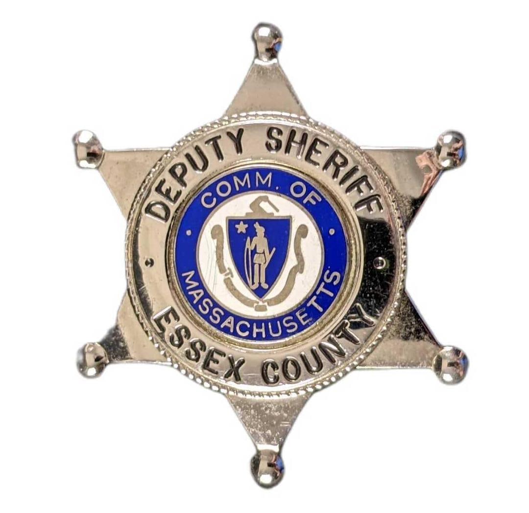 Commonwealth Of Massachusetts Essex Deputy Metal Silver Tone Badge: Commonwealth Of Massachusetts Essex Deputy Metal Silver Tone Badge. Is approx 2 1/2" x 2 1/2" x 3/4" and it weighs under one pound at 0.09lb. The bade is in a good, used condition with lig