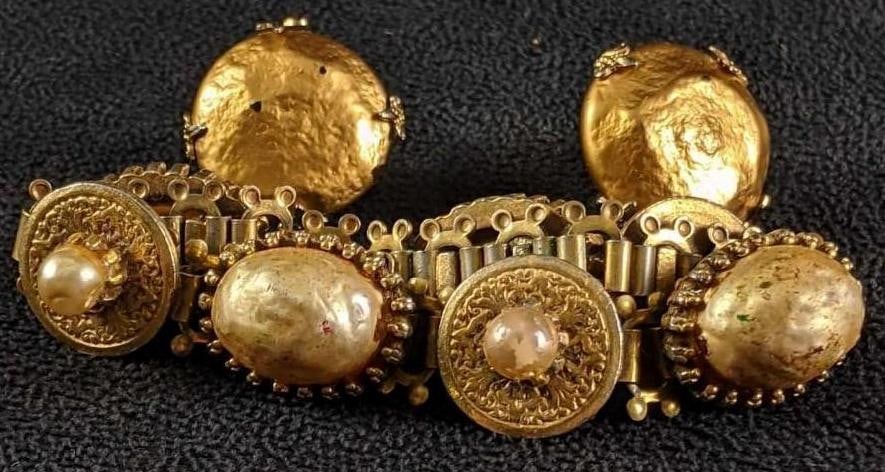 Bracelet and Clip-on Earring Set: Bracelet and Clip-on Earring Set. This set is gold-tone with a bracelet and earrings used the earrings have some black stops that are tiny chips. The total weight is 0.13lb.