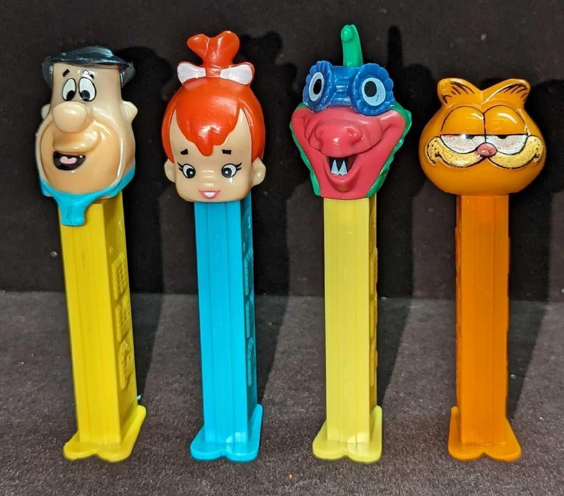 4 Pez Dispensers Garfield Flintstones Dinosaur