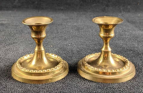 Brass Candle Holders Indian Candle Holders Brass: Brass Candle Holders Indian Candle Holders Brass This lot comes with a pair of brass candle holders made in India. These are in good condition with only small wear on the tops. 2 1/4in tall
