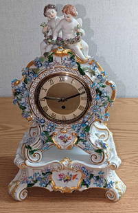"F62" Vintage Meissen Mantel Porcelain Clock With Base: "F62" Vintage Meissen Mantel Porcelain Clock With Base. This clock and base are decorated with hand-painted cherubs and flowers. The base is made to perfectly fit the clock, when the mantle clock is p