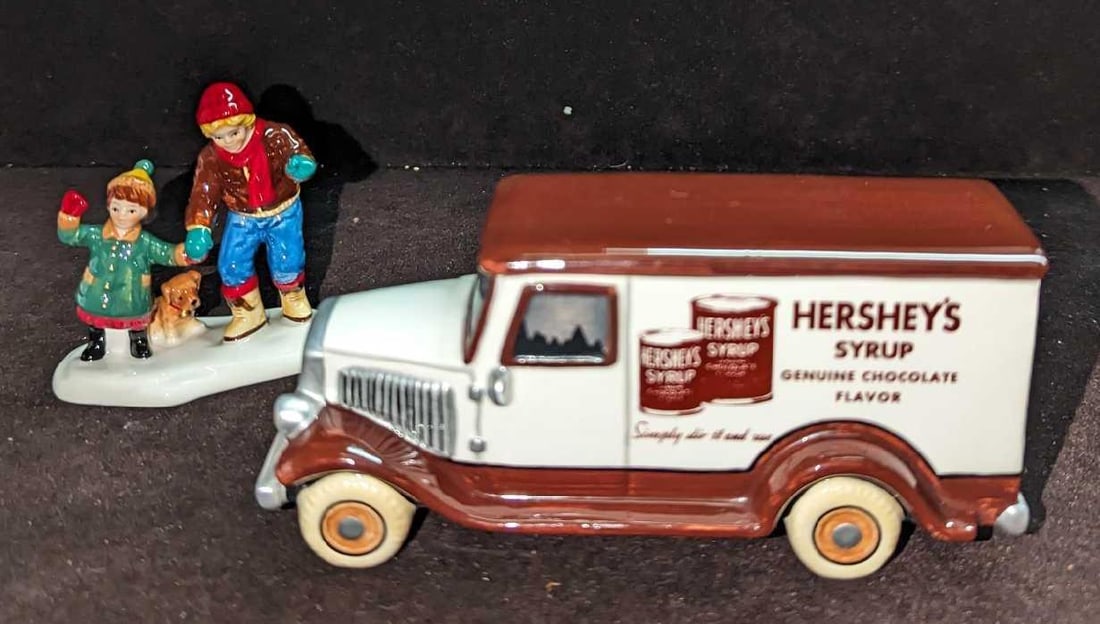 Retired Kids Love Hershey's Snow Village Figurines: Retired Kids Love Hershey's Snow Village Figurines. This was released from the year 1997 to the year 2000. Hand-painted ceramic. Comes with a Hershey's Syrup truck and a two kids figurine (one figurin
