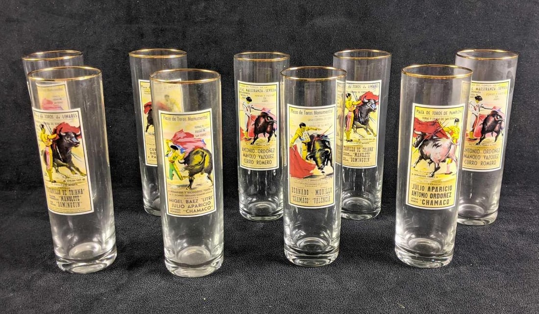 Tall Glasses Bull Vintage Bullfighter Glasses: Tall Glasses Bull Vintage Bullfighter Glasses These are awesome glasses with bullfighter illustrations and gold rims. This is a set of nine glasses that are all 7in tall Weight: all together 3lbs
