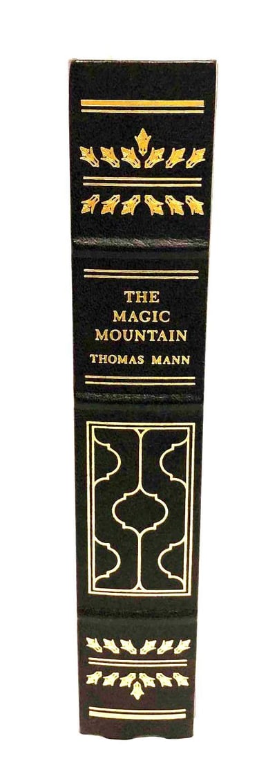 The Magic Mountain By Thomas Mann: This lot contains The Magic Mountain By Thomas Mann. The book is approx 9 1/2" x 6 1/4" and weighs about 2.7lbs. Overall the book is in good used condition with some minor wear from use over t