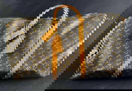 Vintage Louis Vuitton Monogram Duffle Malletier Tag: Vintage Louis Vuitton Monogram Duffle Malletier Tag Pictured is a vintage Louis Vuitton duffle bag with the "Louis Vuitton Malletier" luggage tag and imprints. This bag is in good used condit