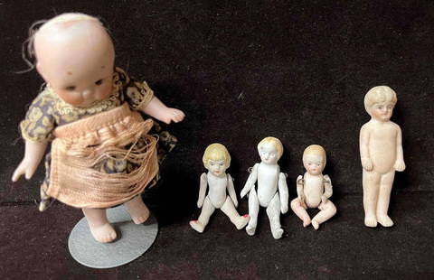 Antique Miniature German Bisque Dolls With Jointed Arms & Legs & Two Bonus Dolls: This lot contains Antique Miniature German Bisque Dolls With Jointed Arms & Legs & Two Bonus Dolls. The Vintage doll bundle fits in a 9 1/2" x 10 1/2" plastic bag. The largest doll doe