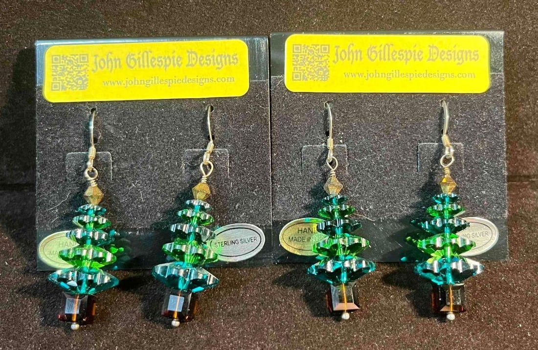 Two Pairs Of Sterling Silver Swarovski Christmas Tree Earrings Emerald & Fern Green Tree Layers (1): This lot contains Two Pairs Of Sterling Silver Swarovski Christmas Tree Earrings Emerald & Fern Green Tree Layers (1). Marked 925. The earrings are one size fits all. Together they weigh about 0.6