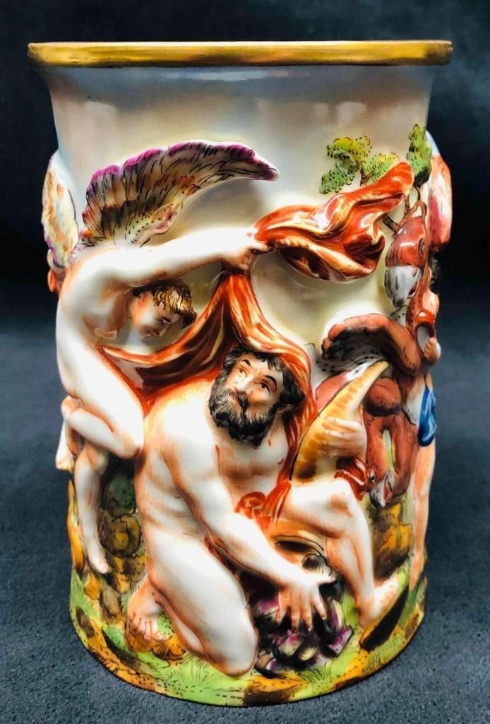 Capodimonte Porcelain Oval Cup: Capodimonte Porcelain Oval Cup. This lot contains the Capodimonte Porcelain Oval Cup. It is approx 3 1/4" x 3 3/4" x 5 3/4" and it weighs about 1lb. Overall the Oval Cup is in good used co