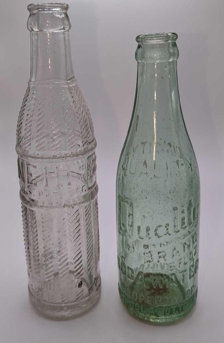 Vintage Quality Brand & Nehi Beverages Glass Bottles: Vintage Quality Brand & Nehi Beverages Glass Bottles. This lot includes: (1) Vintage Quality Brand 6 Oz Soda Water. From The Coca-Cola Bottling Company from Ashley, NC. This bottle is approx 2 1/2