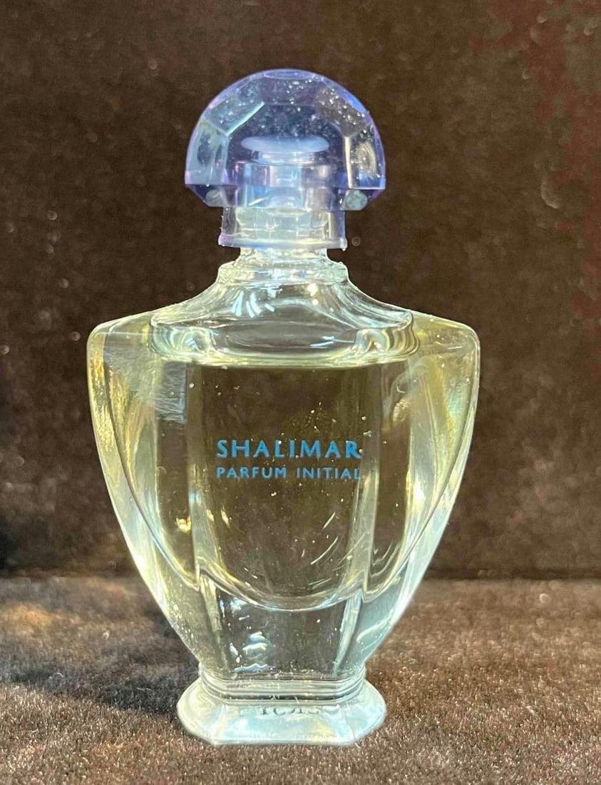 Mini Guerlain Shalimar Parfum Initial: This lot contains a Mini Guerlain Shalimar Parfum Initial. It is approx 3/4" x 3/4" x 2 1/4" and it weighs about 1oz. Overall vintage perfume bottle is in good used condition with some nor
